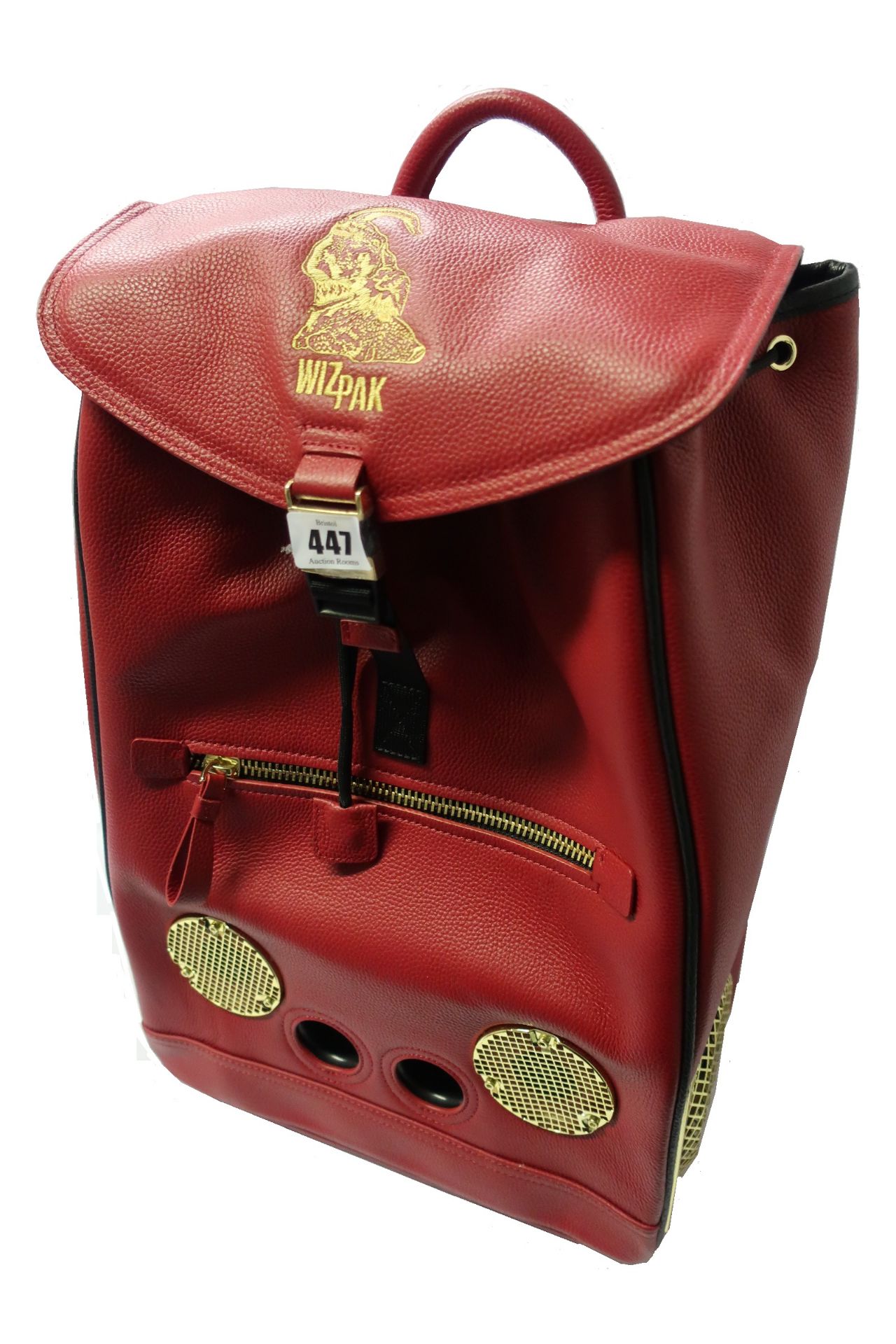 An as new WizPak sound system backpack in red leather with dust bag.