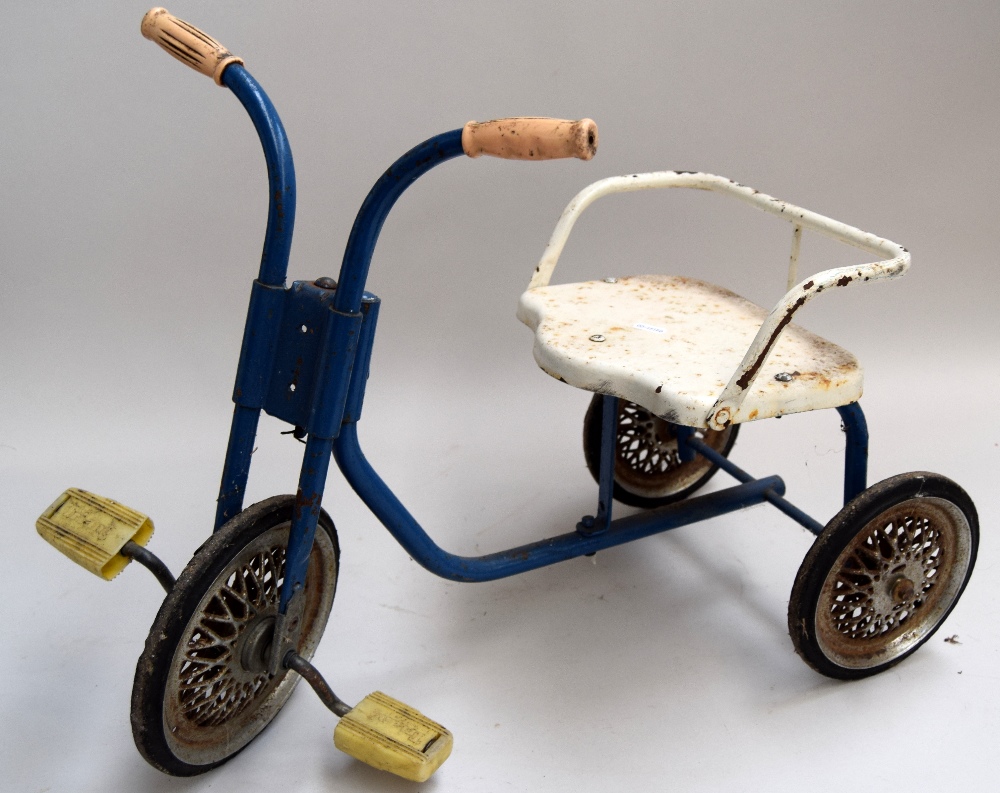 A blue and white painted tricycle for a small child