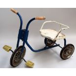 A blue and white painted tricycle for a small child