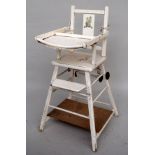 A vintage white painted folding children's high chair