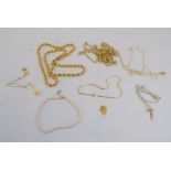 A selection of necklaces including paste pearl and yellow metal chains,