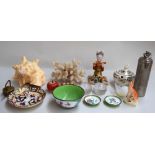 A mixed lot including a large conch shell, a piece of coral, several paperwights,