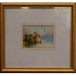 A small Victorian miniature painting of a castle across a lake, framed,