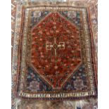 A west Persian rug with blue ground and large central lozenge 160 x 120cm