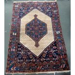 A west persian rug with large cream central lozenge 135 x205cm