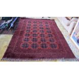 A Bakara carpet of Afghan design, the scarlet field with elephant foot medallions,