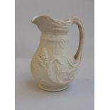 A biscuit porcelain jug displaying maize and stalks inscribed to base TBM, MMA, 20cmH,