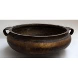 An Asian brass wash bowl,