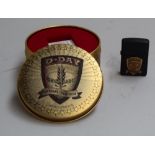 A D-Day commemorative Zippo lighter together with a collection of matchbook covers