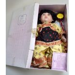 A 'Leonardo Collection' oriental porcelain doll in box