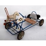 A vintage child's pedal go kart together with a child's walker in the form of a dog (2)