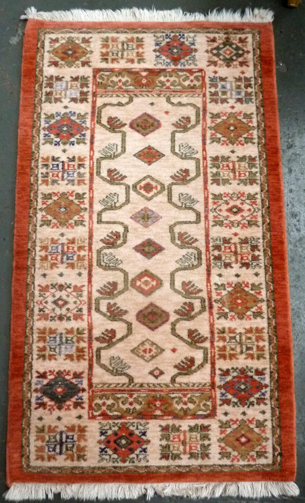 A Kabir wool rug retailed by John Lewis 85 x 155cm