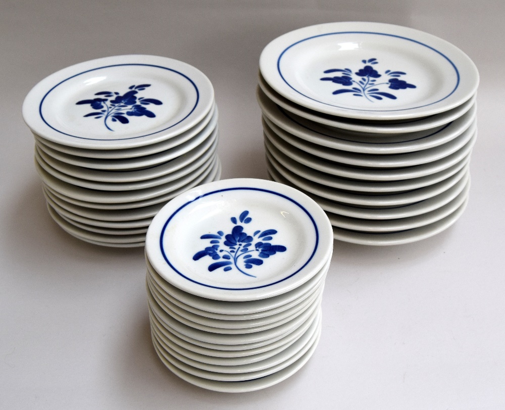 A Portuguese dinner service in blue and white to include plates, side plates, dessert plates, bowls,