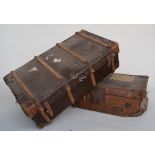 A leather travel trunk inscribed H.