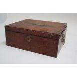 A mahogany writing box containing a large quantity of coins to include crowns, florins, farthings,