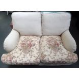 A cream two seater sofa