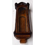 A walnut and fruitwood case for a wall hanging clock 105cmL