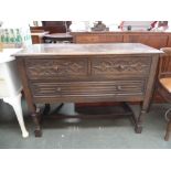 A small sideboard with two short drawers over one long on turned legs,