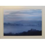 A large photograph of a misty morning in the Marshwood Vale,
