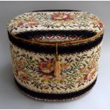 Embroidered sewing stool with hinged lid full of accessories plus an early portable sewing machine