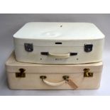 Two white vintage suitcases,