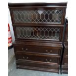 A Globe Wernicke two tier bookcase with leaded glass over two long drawers, bears label,
