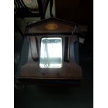 A mahogany commode with hinged lid and a dressing mirror with marquetry inlay and two clothes