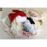 Box of old textiles including old christening gown, dolls clothes table cloths and napkins,