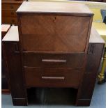 A mid-century art deco style bureau with fitted interior above 2 drawers flanked by bookshelves