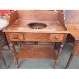 A mahogany wash stand on turned legs