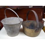 A brass pail and small galvanised metal bucket