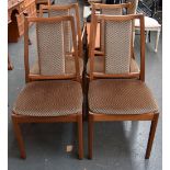 A set of four Nathan dining chairs upholstered in a geometric pattern