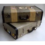 An Innovation striped suitcase with Rhodesian travel stickers and one similar with European travel
