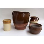 Three stoneware jars and a jug
