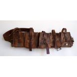 A vintage leather Swedish magazine ammunition belt with five pouches, c.