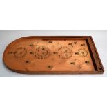 A Bagatelle board and two wooden trays