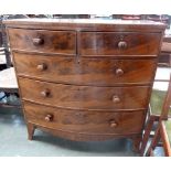 A bow fronted chest of drawers,