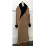 A camel coloured short coat with shawl collar of brown velvet and velvet covered buttons (size 14)