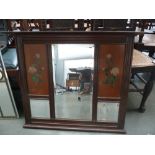 An Art Deco over mantel mirror decorated with roses and one other