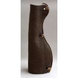 A modern vase with leather stitched side