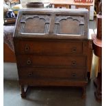 A mahogany bureau with fitted interior raised on turned legs with cross stretcher