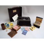 The Baby Empire portable type writer in case with instructions together with various playing cards