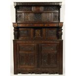 A 17th century court cupboard of tri-part form,