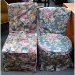 Two bedroom chairs upholstered in floral fabric