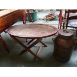 An oval side table and a hardwood tobacco churn,