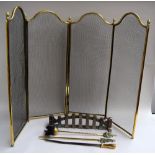 A three-fold four screen brass fireguard with acorn finials 82cmH and a mixed brass companion set