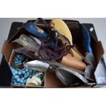 A box of costume jewellery, African napkin rings,