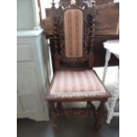 A French hall chair with upholstered seat and back with grape and vine carving