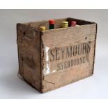 Vintage 'Seymours, Sherborne' bottle crate containing Berry Bros. & Rudd Ltd Hock (37.