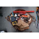 A bag of mixed tools and hand saws